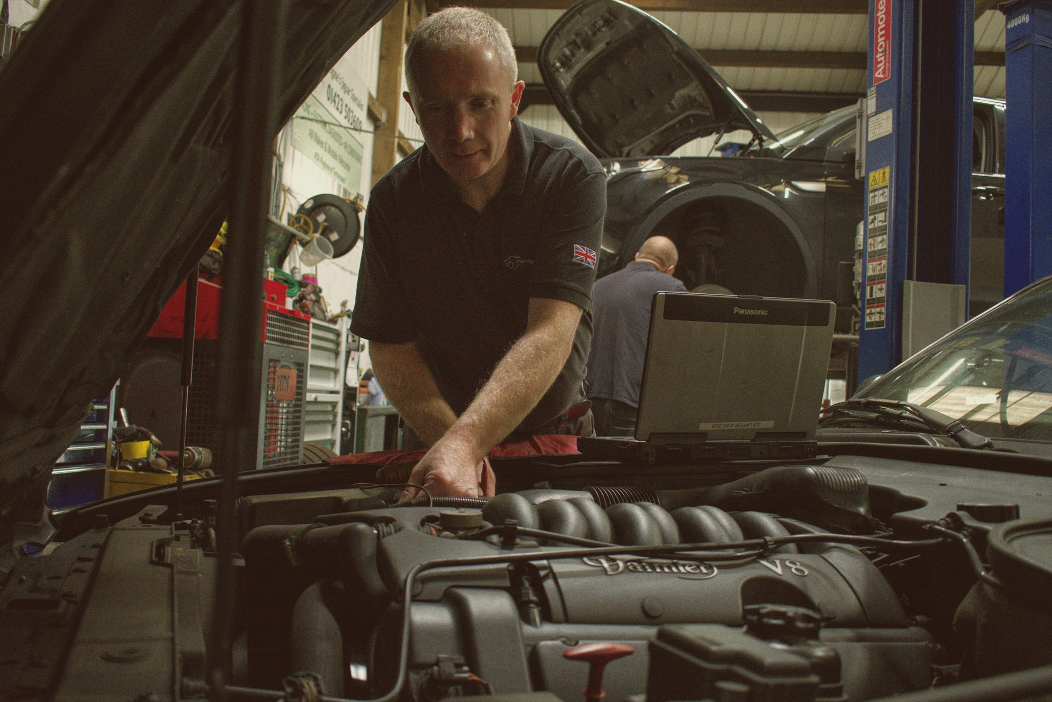 Trevor Montgomery diagnosing a Jaguar under the bonnet